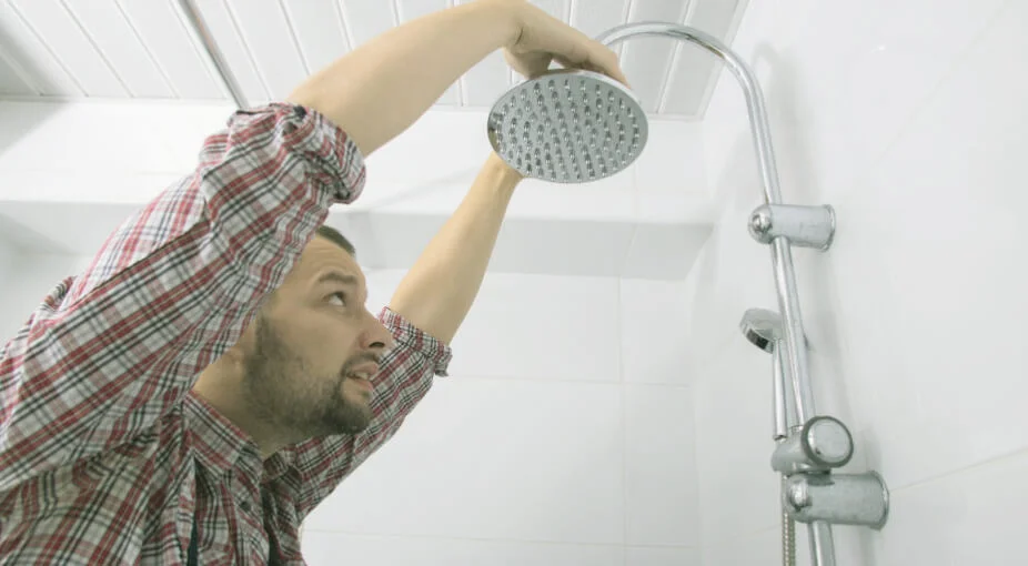 Man Replacing a Showerhead